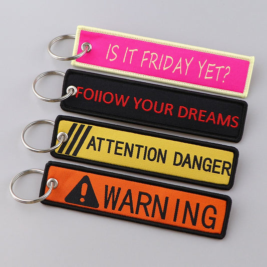 What Is the Meaning Behind Remove Before Flight Keychains?